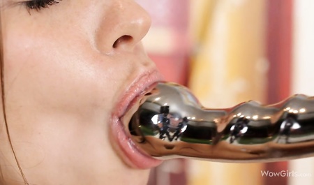 A student engaged in anal Masturbation with a long Dildo