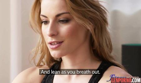 Yoga teacher lowered from the clients tights and teamed member between the elastic buttocks