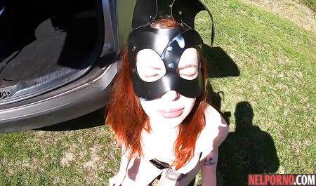 Redhead bitch in a mask outdoors sucks dick a fat husband and Fucks him by the car