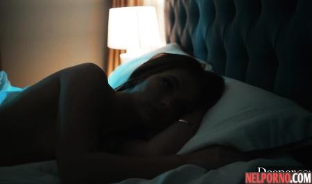 Two young girls and one man in the bedroom engaged in group sex