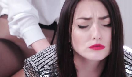 Two sexy lesbians on white background having sex with a strap-on