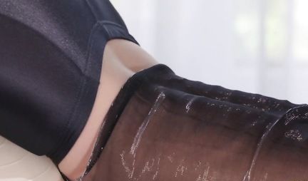 Two lesbians in latex tights fuck each other with a strap-on