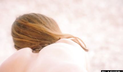 A Negro on the beach inserts big cock in pussy redhead partner