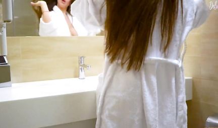 Beautiful girl masturbating in front of mirror and gets home orgasm