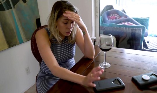 The mother drank red wine and went to the left with her h...