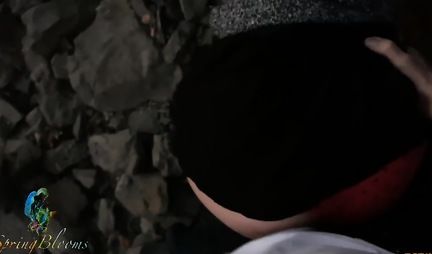 A girl in nature lifts up her black skirt and flashes her tight ass in red panties