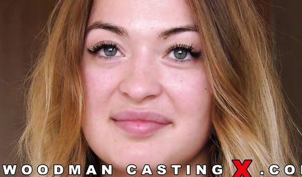 Slim girl at the casting undresses and shows tattoos on an appetizing body