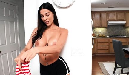 Tattooed brunette in striped stockings jumps on the penis of a shaved neighbor