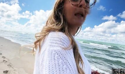 A young couple meets for sex in a tent on the shore of a blue-blue sea