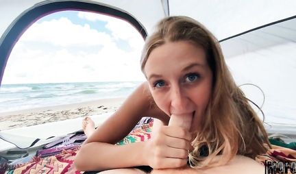 A young couple meets for sex in a tent on the shore of a blue-blue sea