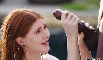 A Negro with a big and thick penis fucks a redhead girl and brings to orgasm