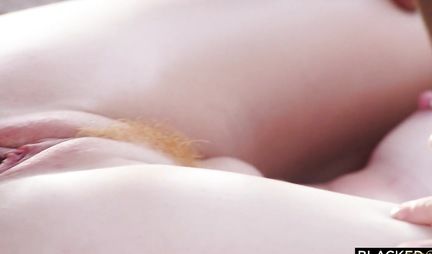 A Negro with a big and thick penis fucks a redhead girl and brings to orgasm