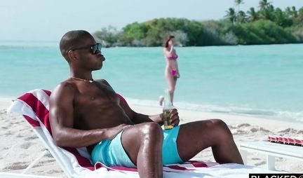 A brunette in a bikini in nature substitutes a juicy hole for anal with a black man