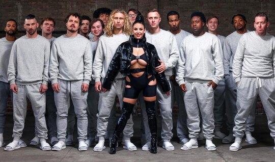 A girl with big tits gives a blowjob to all the guys in a...