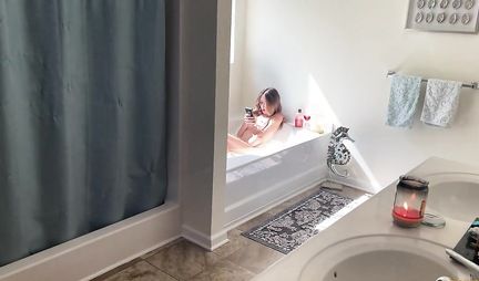 The girl sits down with a wet pussy on the guy's cock in the bathroom