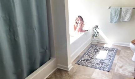 The girl sits down with a wet pussy on the guy's cock in the bathroom