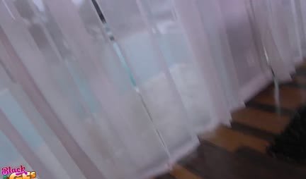 The mulatto demonstrates her big boobs to a friend