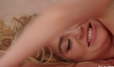 Blondes give gentle lesbian caresses to each other in bed