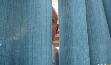 A stewardess with big tits caresses a passenger's penis on a plane