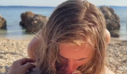 Russian wet chick gives a blowjob to a guy on a wild beach