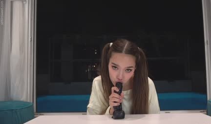 Cutie learns to suck on a rubber dick and masturbates her pussy