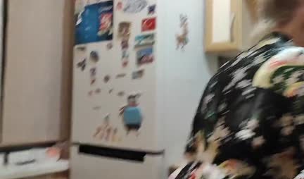 A young housewife in a robe gets up doggy style for fun