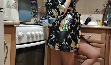 A young housewife in a robe gets up doggy style for fun