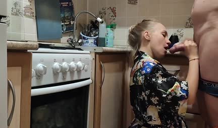 A young housewife in a robe gets up doggy style for fun