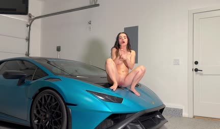 Young girl coolly masturbates at a cool car