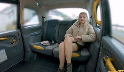 The blonde is ready to surrender to the taxi driver right in the car