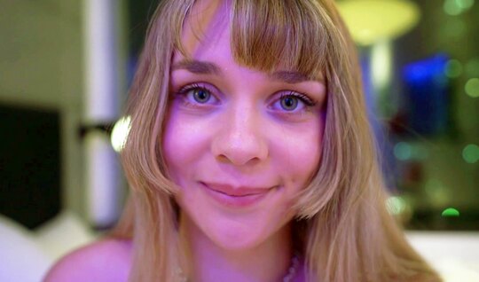 In the video close -up, the blonde seductively stood up w...