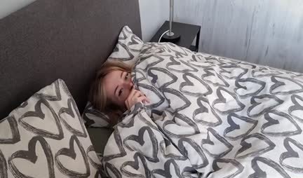 A young girl in socks pleased the guy with a blowjob in bed