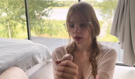 Young bitch with glasses skillfully sucks a strong trunk of a friend