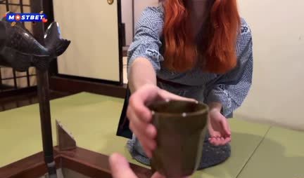 Red-haired entertainer skillfully sucks her boyfriend's trunk outdoors