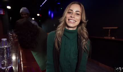 In public, a girl with a gorgeous ass straddles a strong trunk