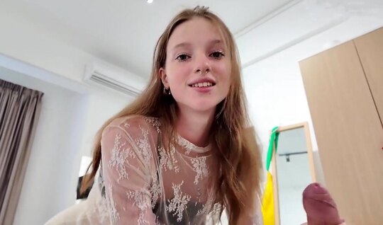 Cute young girl skillfully sucks her boyfriend's shaft