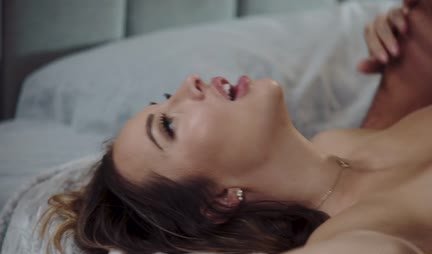 A brunette with her boyfriend had passionate sex in bed