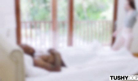 Cute chick sucks a big dick of a black man before anal sex